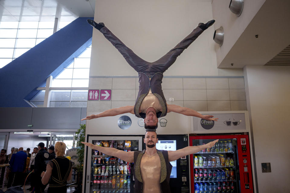 Metropolitan Circus performers warm-up inside the the Henri Coanda International Airport in Otopeni, near Bucharest, Romania, April 19, 2024. (AP Photo/Andreea Alexandru)