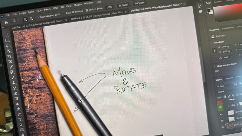 Photoshop file with pencil and paper open on laptop screen