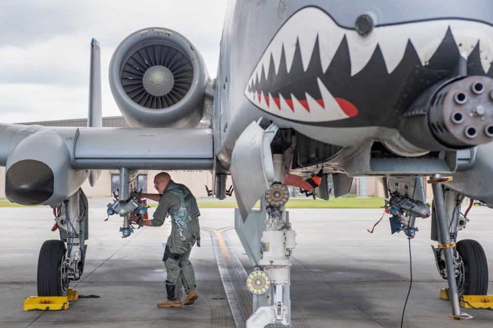 Pilot conducts pre-flight inspection of his A-10C Thunderbolt II attack aircraft