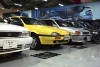 <p>Also tucked into the back of the room is a very yellow example of a Nissan SunnyNX Coupe, known stateside as the NX. </p>