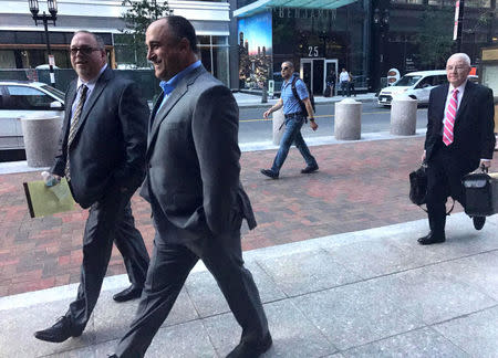 FILE PHOTO: Teamsters Local 25 members Daniel Redmond (L) and Robert Cafarelli (C) enter the federal court in Boston, Massachusettes, U.S., July 31, 2017. REUTERS/Nate Raymond/File Photo