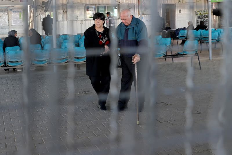 Christian Palestinian couple leaves Gaza Strip through Israeli Erez crossing heading to Bethlehem to attend Christmas celebrations, in the northern Gaza Strip