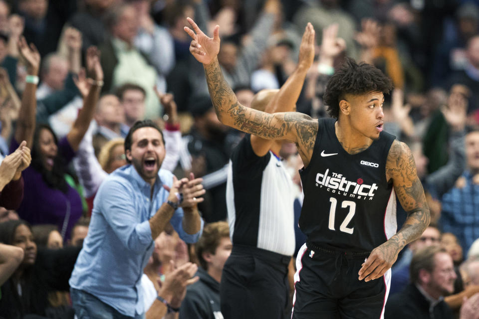 Washington Wizards forward Kelly Oubre Jr. (12) celebrates after a 3-point shot during the overtime period of an NBA basketball game against the Boston Celtics, Wednesday, Dec. 12, 2018, in Washington. The Celtics won 130-125. (AP Photo/Alex Brandon)