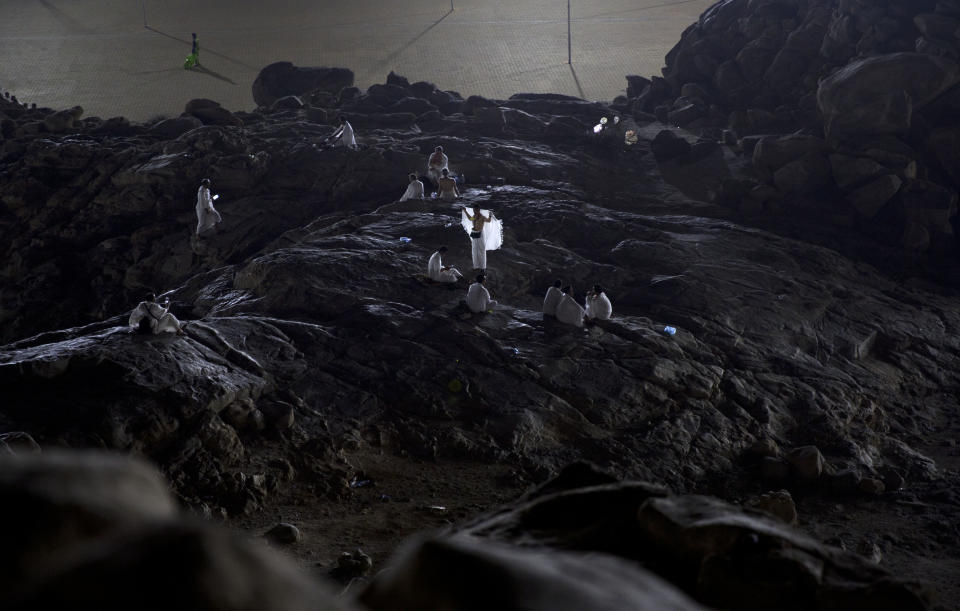 Ppilgrims pray on Jabal Al Rahma holy mountain