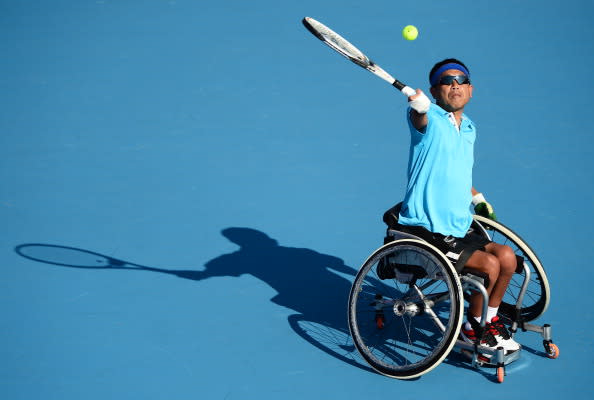 Mitsuteru Moroishi of Japan in action during his Quad Doubles Wheelchair Tennis semifinal's match against Peter Norfolk and Andy Lapthorne of Great Britain on Day 5 of the London 2012 Paralympic Games at Eton Manor on September 3, 2012 in London, England. Great Britain won the match 6-2, 6-2. (Photo by Justin Setterfield/Getty Images)