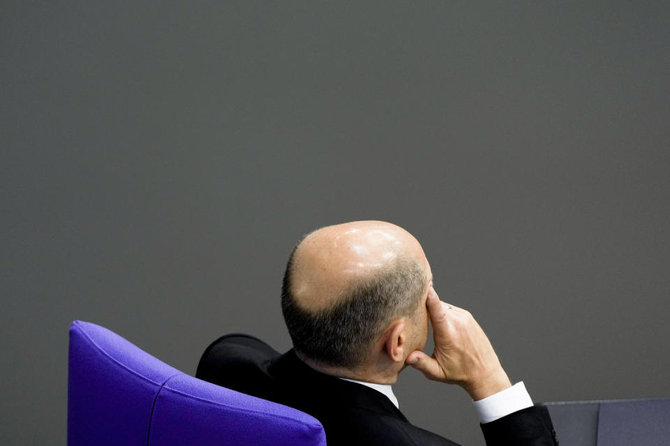 German Chancellor Olaf Scholz listens to the debate at the German parliament Bundestag ahead of an EU summit at the Reichstag building in Berlin, Germany, Thursday, Oct. 20, 2022. (AP Photo/Markus Schreiber)