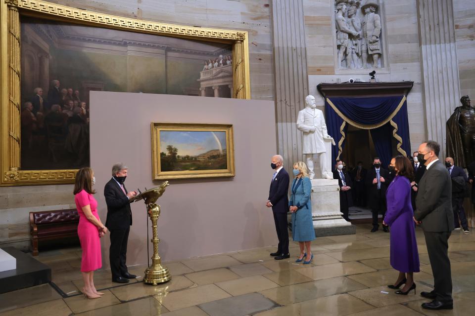 Sen. Roy Blunt, R-Mo, presents a painting to President Joe Biden and first lady Jill Biden, as Vice President Kamala Harris and Doug Emhoff look on at the presentation of gifts ceremony after the 59th Presidential Inauguration at the U.S. Capitol in Washington, Jan. 20, 2021.