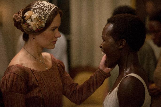 This image released by Fox Searchlight shows Sarah Paulson, left, and Lupita Nyong'o in a scene from "12 Years A Slave." (AP Photo/Fox Searchlight, Francois Duhamel)