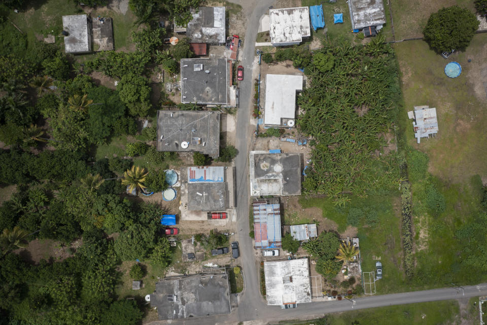 Aerial view of Jetsabel Osorio's home and her neighborhood in Loiza, Puerto Rico, Thursday, Sept. 15, 2022. Thousands of homes, roads and recreational areas have yet to be fixed or rebuilt since Hurricane Maria struck the U.S. territory nearly five years ago. (AP Photo/Alejandro Granadillo)