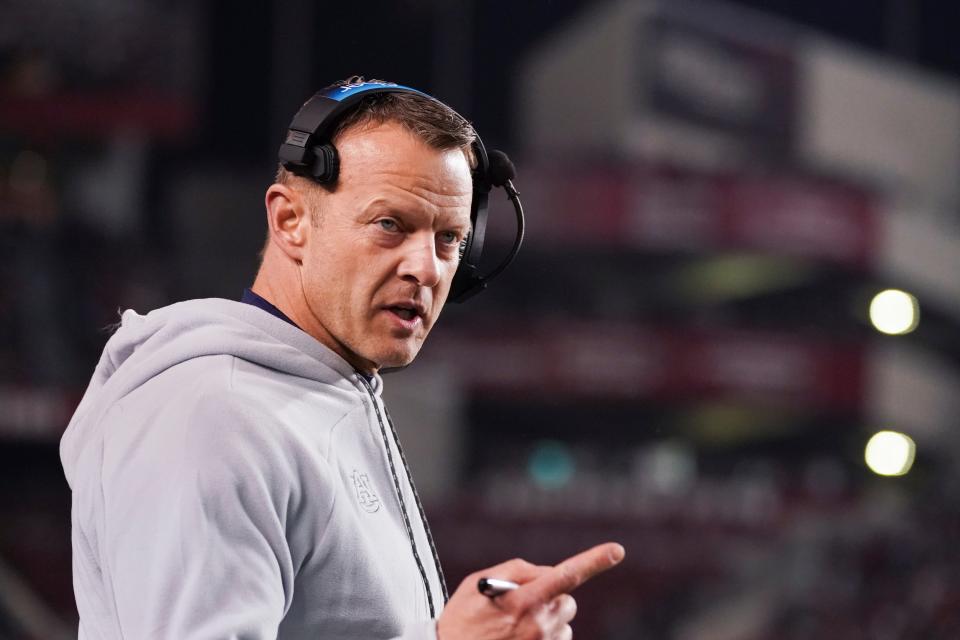 Auburn head coach Bryan Harsin talks to an official during the first half of an NCAA college football game against South Carolina, Saturday, Nov. 20, 2021, in Columbia, S.C. (AP Photo/Sean Rayford)