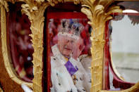 <p>LONDON, ENGLAND - MAY 06: King Charles III waves from the Gold State Coach built in 1760 and used at every Coronation since that of William IV in 1831sets off from Westminster Abbey on route to Buckingham Palace during the Coronation of King Charles III and Queen Camilla on May 06, 2023 in London, England. The Coronation of Charles III and his wife, Camilla, as King and Queen of the United Kingdom of Great Britain and Northern Ireland, and the other Commonwealth realms takes place at Westminster Abbey today. Charles acceded to the throne on 8 September 2022, upon the death of his mother, Elizabeth II. (Photo by Rob Pinney/Getty Images)</p> 