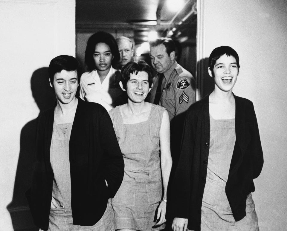 FILE - Three women co-defendants in the Sharon Tate murder case, from left, Susan Atkins, Patricia Krenwinkel and Leslie Van Houten, laugh as they walk to court in Los Angeles for sentencing on March 29, 1971. Van Houten, one of Charles Manson's followers, was released from prison on parole on Tuesday, July 11, 2023. (AP Photo/File)