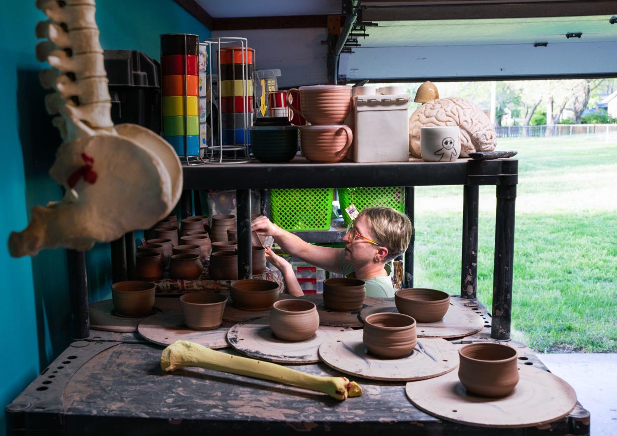 Springfield artist Mari Moore-Mosby turns over works-in-progress in her personalized ceramics studio.