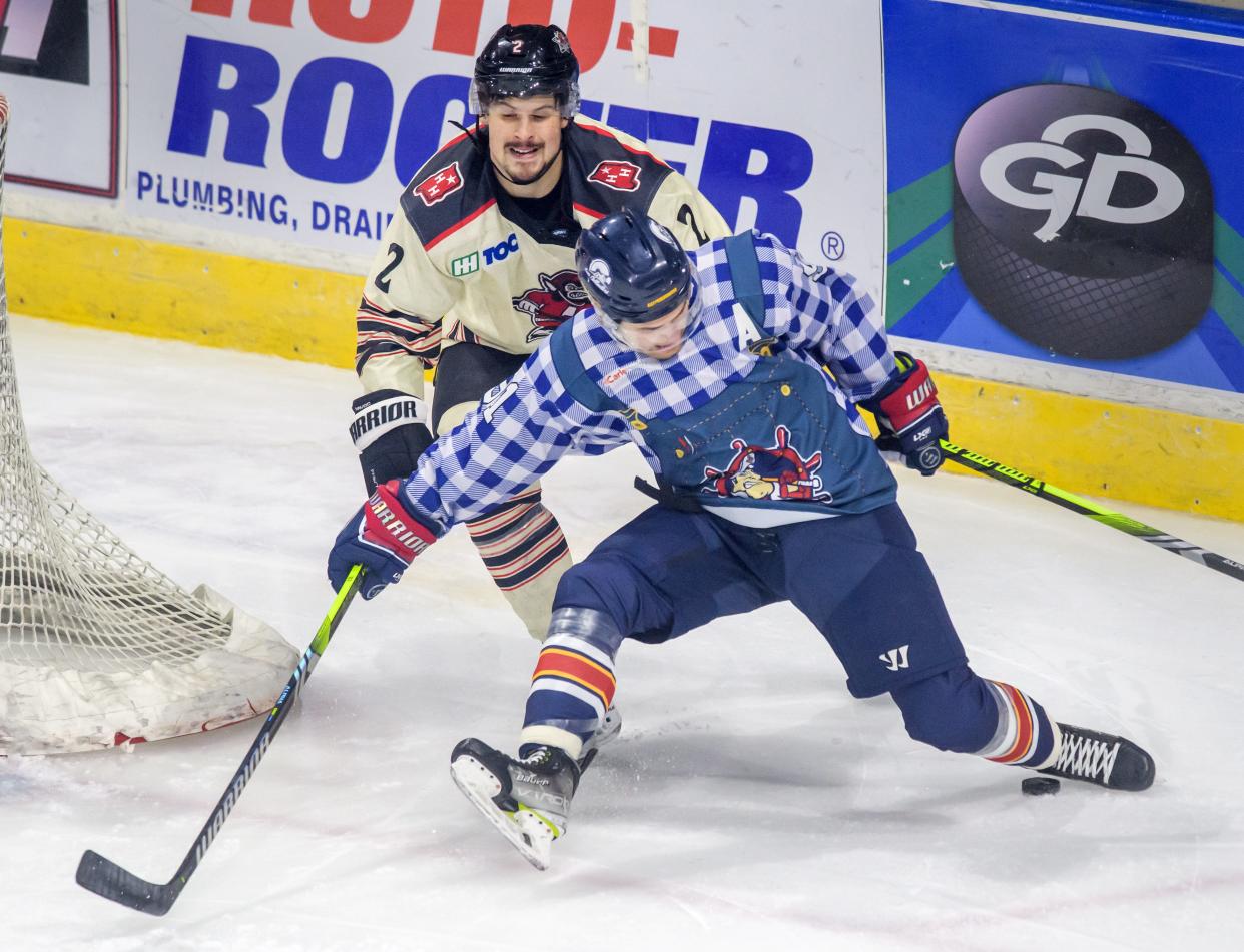 Huntsville's Dominick Procopio (2) and Peoria's Alec Baer tangle behind the net in the first period of their SPHL hockey match Friday, Jan. 12, 2024 at Carver Arena in Peoria. The Rivermen fell to the Havoc 4-3 in a sudden-death shootout.