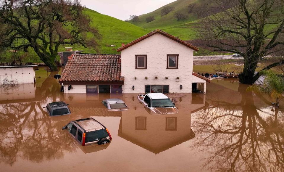 Flooded house seen partially underwater in Gilroy, California, on Thursday (AFP via Getty Images)