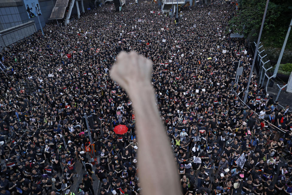 Protesters march on the streets against an extradition bill in Hong Kong on Sunday, June 16, 2019. Hong Kong residents were gathering Sunday for another massive protest over an unpopular extradition bill that has highlighted the territory's apprehension about relations with mainland China, a week after the crisis brought as many as 1 million into the streets. (AP Photo/Vincent Yu)