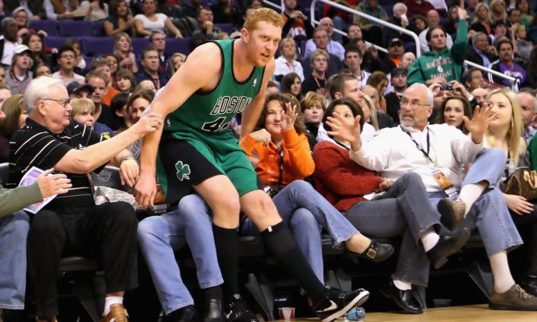 Brian Scalabrine falling into the crowd at a Celtics game.