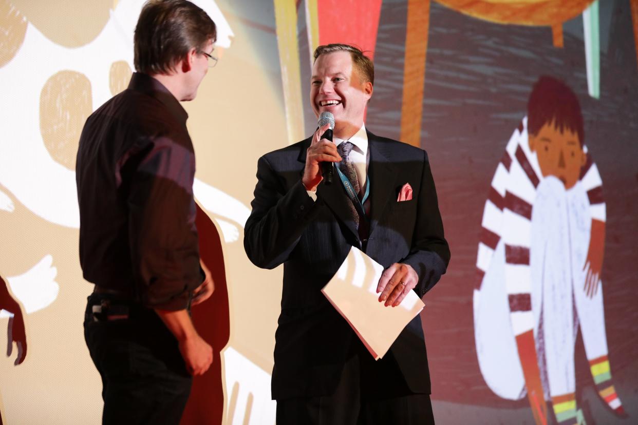 Jonathan Jackson (right), CEO and artistic director of Milwaukee Film, and County Executive and past Milwaukee Film board chair Chris Abele share the stage on opening night of the 2018 Milwaukee Film Festival. Jackson announced his resignation Jan. 9, after 16 years heading up the organization.