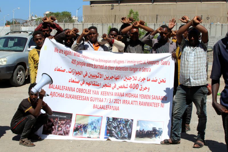 Ethiopian migrants gather to protest their treatment in the war-torn country during a sit-in outside a compound of United Nations organizations in the southern port city of Aden