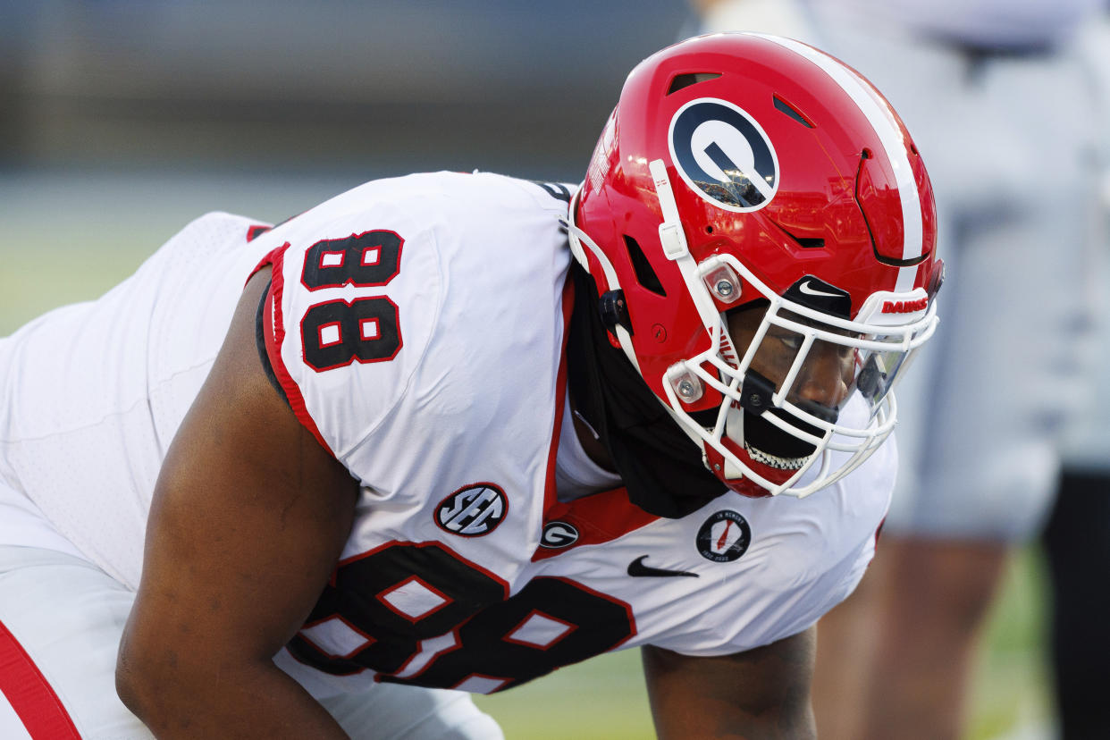 FILE - Georgia defensive lineman Jalen Carter warms up before an NCAA college football game in Lexington, Ky., Saturday, Nov. 19, 2022. Defending-champion Georgia will host the Buckeyes in its own backyard during the Peach Bowl on New Year’s Eve.(AP Photo/Michael Clubb, File)