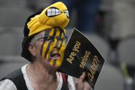 A fan cheers after an NCAA Women's Final Four semifinals basketball game between Iowa and South Carolina Friday, March 31, 2023, in Dallas. Iowa won 77-73 to advance to the championship on Sunday. (AP Photo/Darron Cummings)