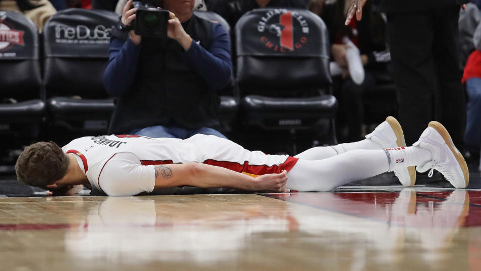 Tyler Johnson of the Miami Heat lays on the floor after suffering an apparent leg injury against the Chicago Bulls at the United Center on Jan. 15, 2018. (Getty)