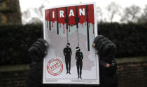 <p>Opponents of Iranian President Hassan Rouhani hold a protest outside the Iranian embassy in west London, Britain, Jan. 2, 2018. (Photo: Simon Dawson/Reuters) </p>