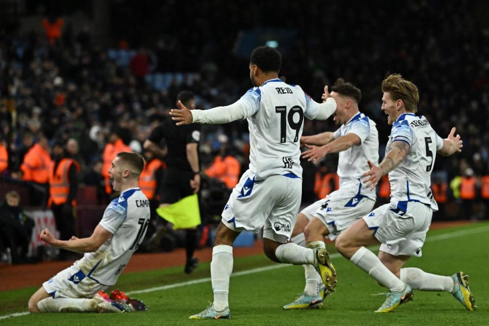 Stevenage celebrated wildly after downing Villa (AFP via Getty Images)