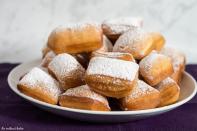 <p>One of the true culinary highlights of New Orleans is the beignet. <a href="http://www.theredheadbaker.com/" rel="nofollow noopener" target="_blank" data-ylk="slk:The Redhead Baker;elm:context_link;itc:0;sec:content-canvas" class="link "><strong>The Redhead Baker</strong></a> keeps her recipe authentic - and true to form, these pastries need to be served fresh and hot. These fried, doughy choux pastries are fluffy, sweet, and the perfect indulgence for breakfast.<br><br><a href="http://www.theredheadbaker.com/classic-new-orleans-beignets/" rel="nofollow noopener" target="_blank" data-ylk="slk:For the Classic New Orleans Beignets recipe, click here.;elm:context_link;itc:0;sec:content-canvas" class="link "><strong>For the Classic New Orleans Beignets recipe, click here.</strong></a></p>