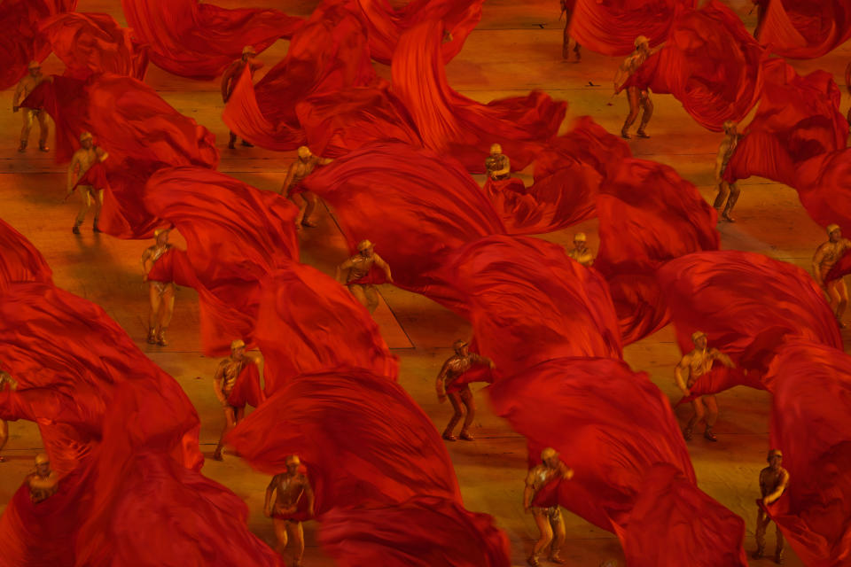 Performers take part in a gala show ahead of the 100th anniversary of the founding of the Chinese Communist Party in Beijing on Monday, June 28, 2021. China is marking the centenary of its ruling Communist Party this week by heralding what it says is its growing influence abroad, along with success in battling corruption at home. (AP Photo/Ng Han Guan)