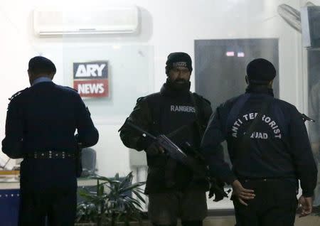 Paramilitary soldiers stand guard at the ARY News offices after a blast injured several people and caused property damage in Islamabad, Pakistan January 13, 2016. REUTERS/Caren Firouz