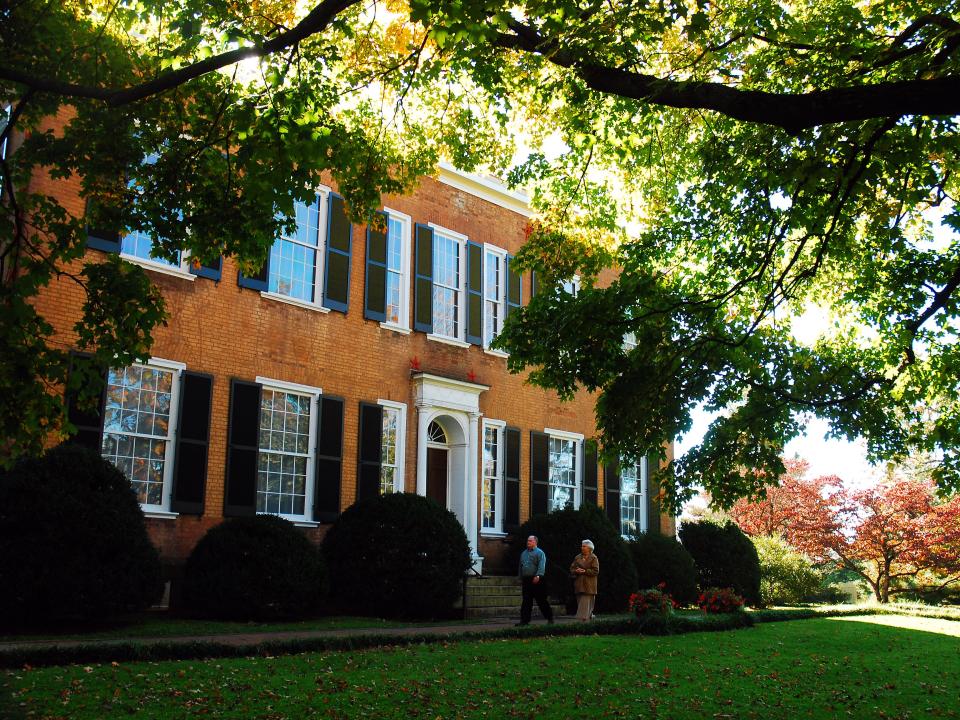 Federal Hill  building with people walking in front of it in Bardstown, Kentucky.