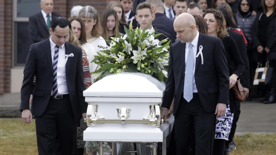 Pallbearers carry a casket following the funeral services for Consuelo Alejandra Haynie, daughters 12-year-old Milan and 15-year-old Alexis and 14-year-old son Matthew Friday, Jan. 24, 2020, in Grantsville, Utah. The killing of a Utah mother and three of her children by a gunman identified by police as her 16-year-old son is "nearly unbearable" for the father who survived, a lawyer said Thursday, Jan. 23, 2020. (AP Photo/Rick Bowmer)