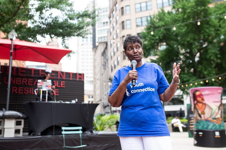 Grenae Dudley, CEO of the Youth Connection tells a story of the Frog King, an African folktale during Freedom Day Celebration at the Capitol Park in Detroit on Wednesday, June 19, 2024.