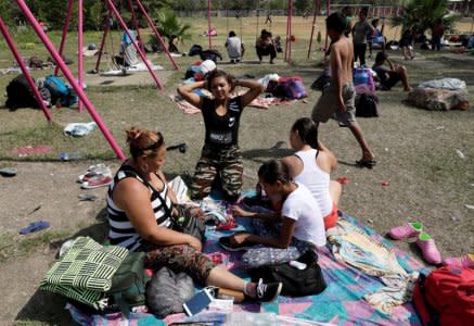 Central American migrants take a break from traveling in their caravan, as they journey to the U.S., in Matias Romero, Oaxaca, Mexico April 3, 2018. REUTERS/Henry Romero