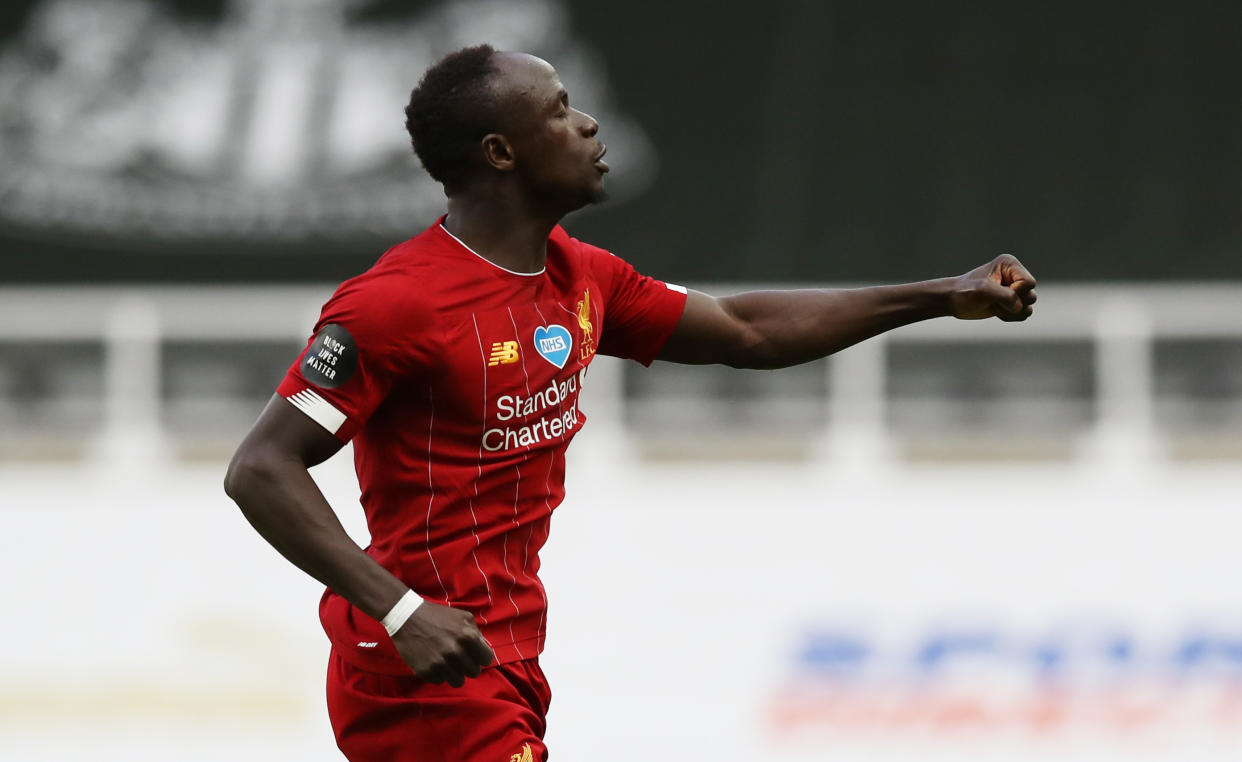 Soccer Football - Premier League - Newcastle United v Liverpool - St James' Park, Newcastle, Britain - July 26, 2020  Liverpool's Sadio Mane celebrates scoring their third goal, as play resumes behind closed doors following the outbreak of the coronavirus disease (COVID-19) Pool via REUTERS/Owen Humphreys EDITORIAL USE ONLY. No use with unauthorized audio, video, data, fixture lists, club/league logos or 'live' services. Online in-match use limited to 75 images, no video emulation. No use in betting, games or single club/league/player publications.  Please contact your account representative for further details.