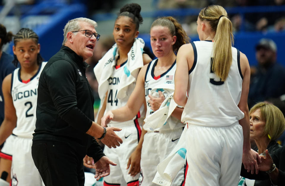UConn head coach Geno Auriemma talks with guard Paige Bueckers as she comes off the court during the Huskies' season-opening game against Dayton on Wednesday. (David Butler II/USA TODAY Sports)