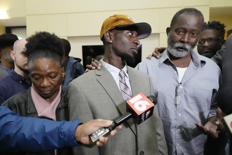 Melvin Jenkins, right, comments on the sentencing of six former Mississippi law enforcement officers for the racially motivated torture of his son, Michael Corey Jenkins, center, and his friend, Eddie Terrell Parker, Wednesday, April 10, 2024, in Brandon, Miss. Also attending the sentencing was Michael's mother, Mary Jenkins, left. (AP Photo/Rogelio V. Solis)