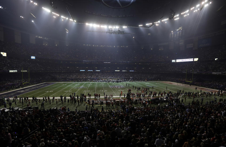 Half the lights are out in the Superdome during a power outage in the second half of the NFL Super Bowl XLVII football game between the San Francisco 49ers and Baltimore Ravens on Sunday, Feb. 3, 2013, in New Orleans. (AP Photo/Gerald Herbert)