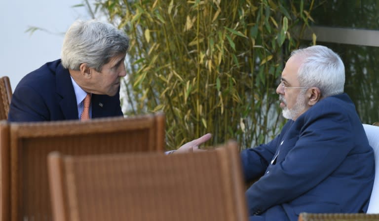 US Secretary of State John Kerry (L) talks with Iranian Foreign Minister Mohammad Javad Zarif on the sidelines of crunch nuclear talks in Geneva in June