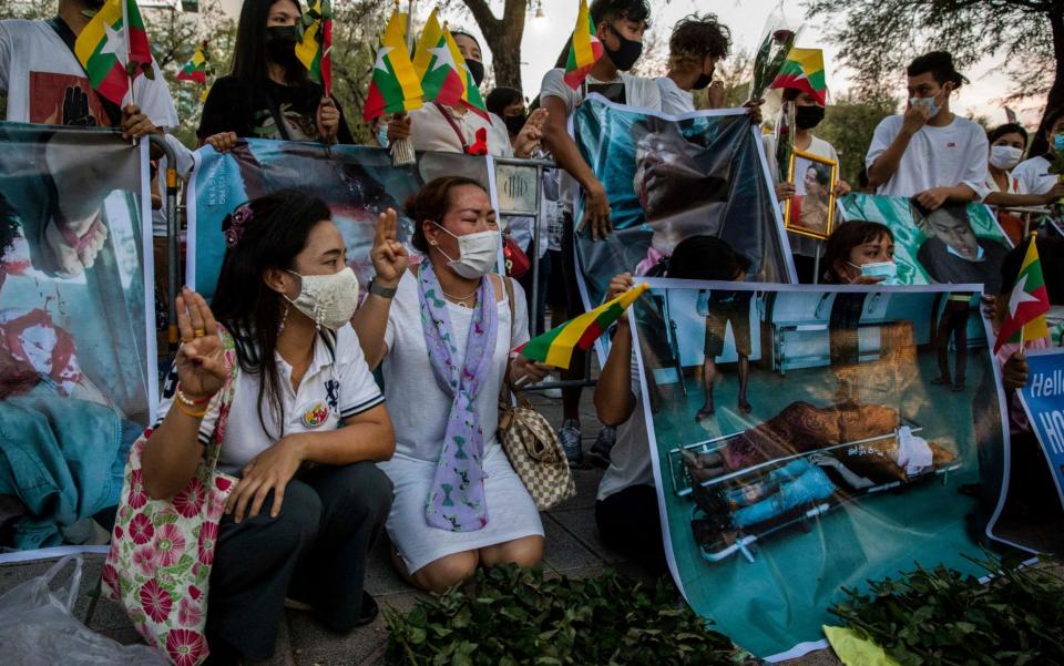 Myanmar nationals hang posters and funeral wreaths in front of the United Nations with images of protesters in Myanmar who have been killed by police and military - Lauren DeCicca /Getty Images AsiaPac 