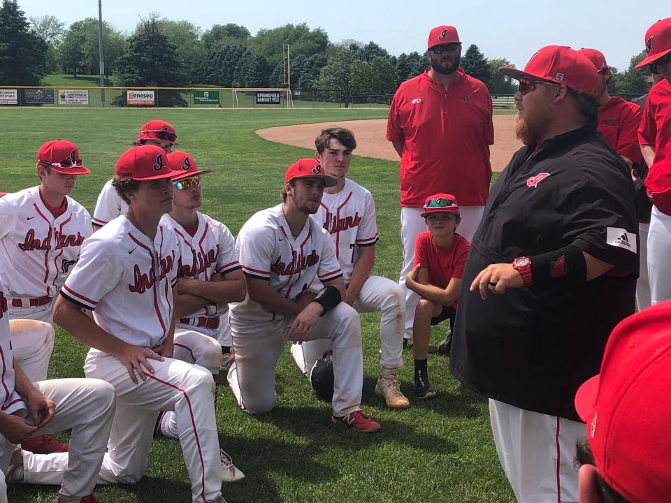 A disappointed Brimfield-Elmwood team gathers around head coach Brandon Porter after their season ended with a 10-0 loss to Joliet Catholic in the IHSA Class 2A Geneseo Supersectional on Monday, May 30, 2022 at Bollen Field.