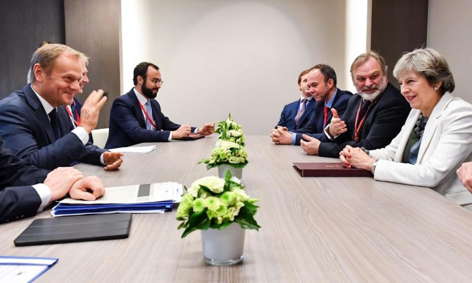 British Prime Minister Theresa May and European Council President Donald Tusk (L) participate in a bilateral meeting during an EU summit in Brussels.