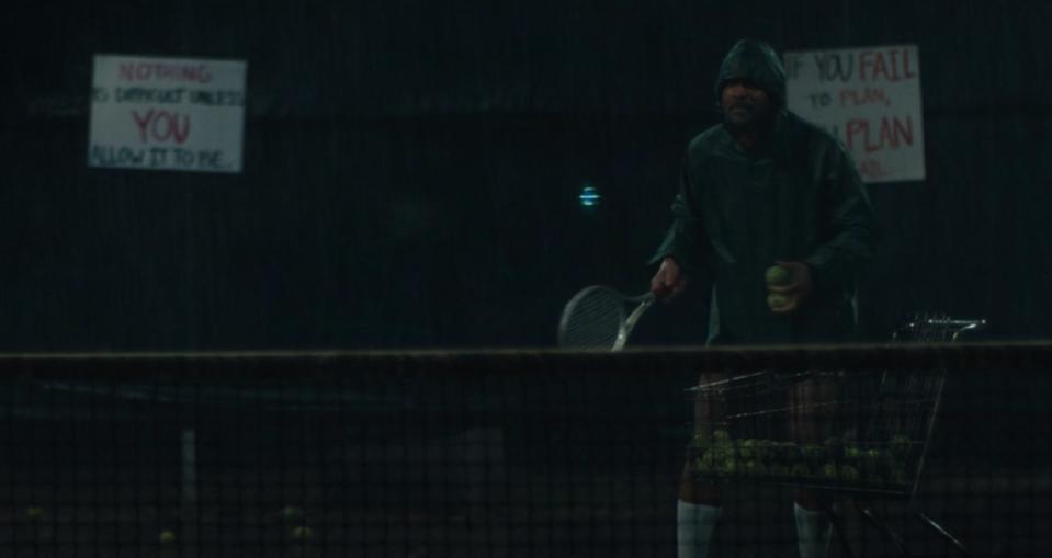 Richard instructs the girls during a rainfall