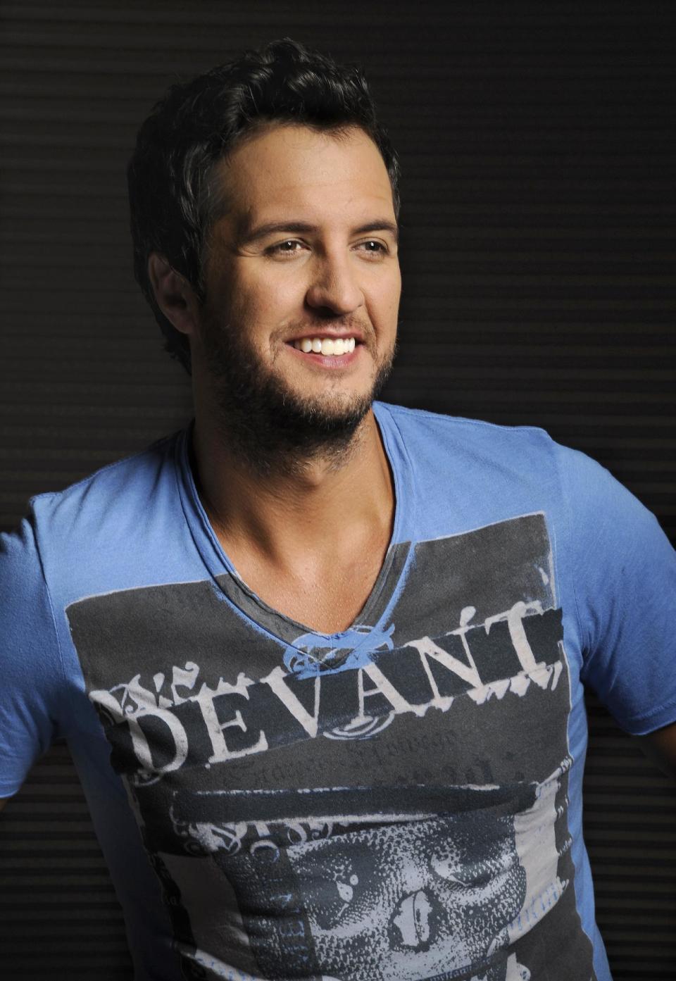 In this Tuesday, July 16, 2013 photo, Luke Bryan poses for a portrait at Audio Productions in Nashville, Tenn. Bryan has taken an unusual approach to the business side of his career since winning the Academy of Country Music's entertainer of the year in April: He's turning down almost everything. (Photo by Donn Jones/Invision/AP)