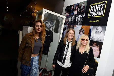 Kurt Cobain's daughter Frances Bean Cobain, his sister Kim Cobain and mother Wendy O'Connor attend the opening of 'Growing Up Kurt' exhibition. REUTERS/Clodagh Kilcoyne