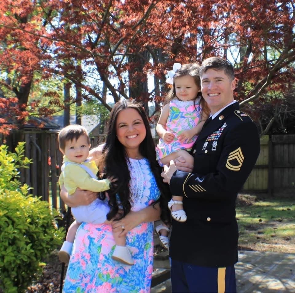 Sgt. 1st Class Robert Nicoson with his wife Beverly and their two children.