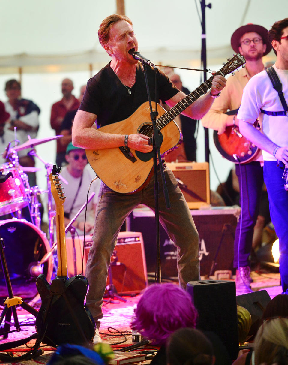 <p>Damian Lewis mans the mic on Aug. 7 while performing at the Wilderness Festival at Cornbury Park in Charlbury, England.</p>