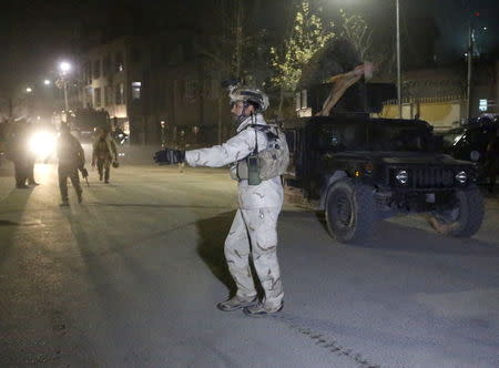 Members of Afghan Crisis Response Unit (CRU) arrive at the site of a Taliban attack in the Afghan capital of Kabul, Afghanistan December 11, 2015. REUTERS/Omar Sobhani