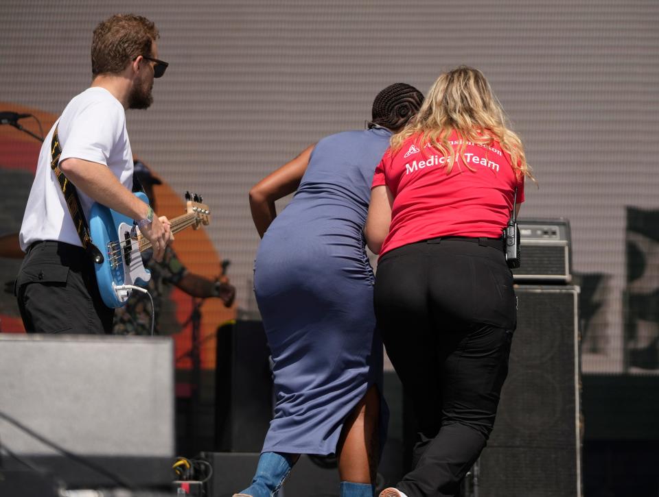 Yaya Bey is helped off the stage by a member of the medical team during her performance at the Austin City Limits Music Festival at Zilker Park on Saturday October 7, 2023.